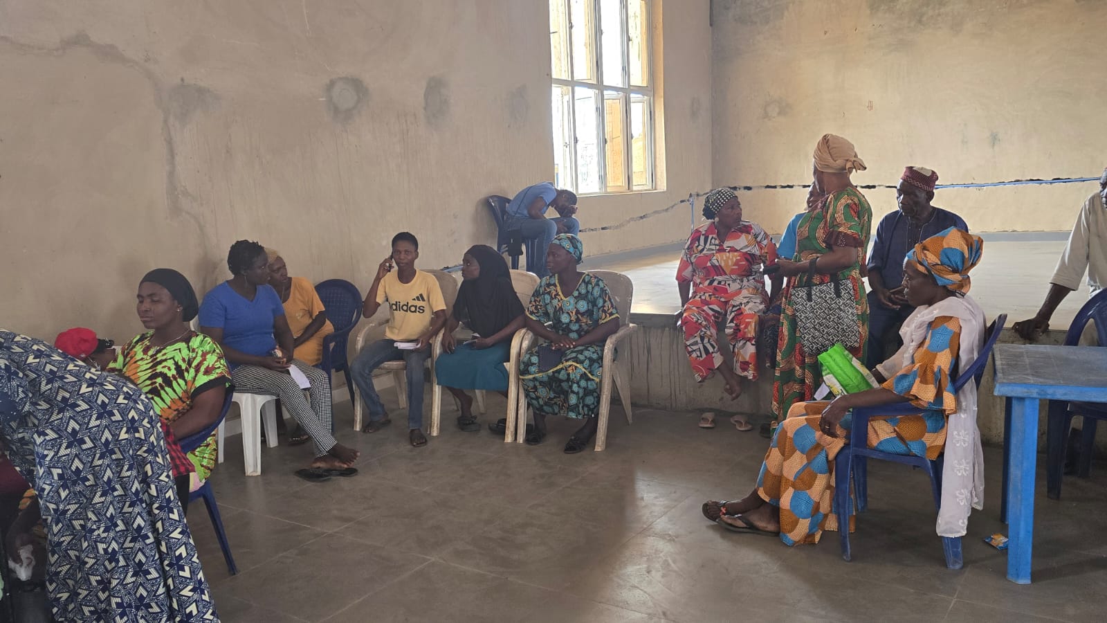 Community members gathering to be seen during the outreach