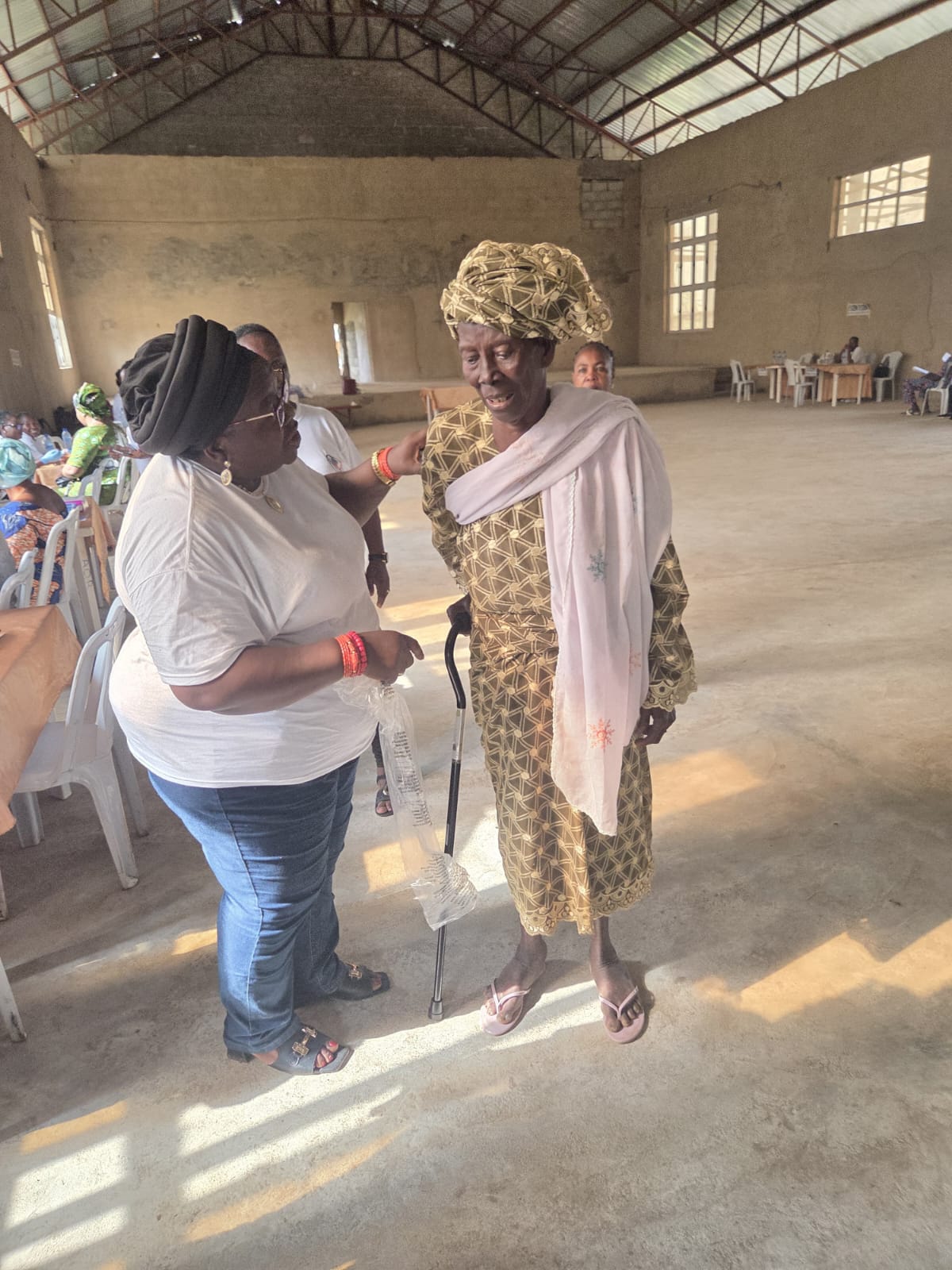 A volunteer checking in with an elder in the community