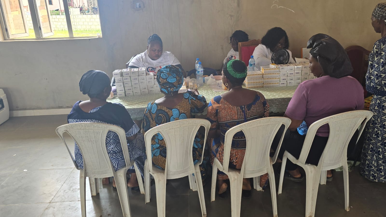 Volunteers sorting and distributing medication to community members