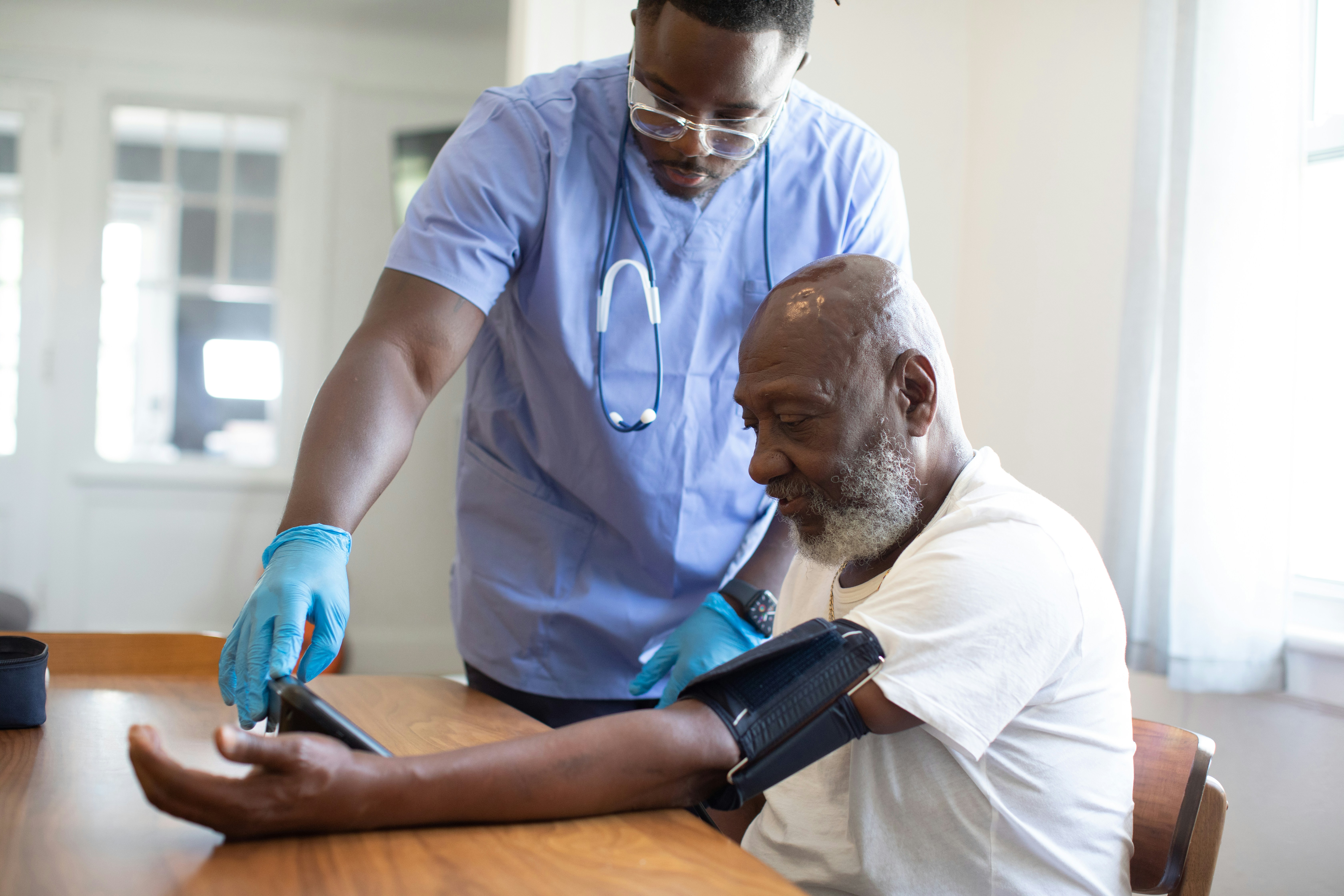 Healthcare worker providing medical care to a patient